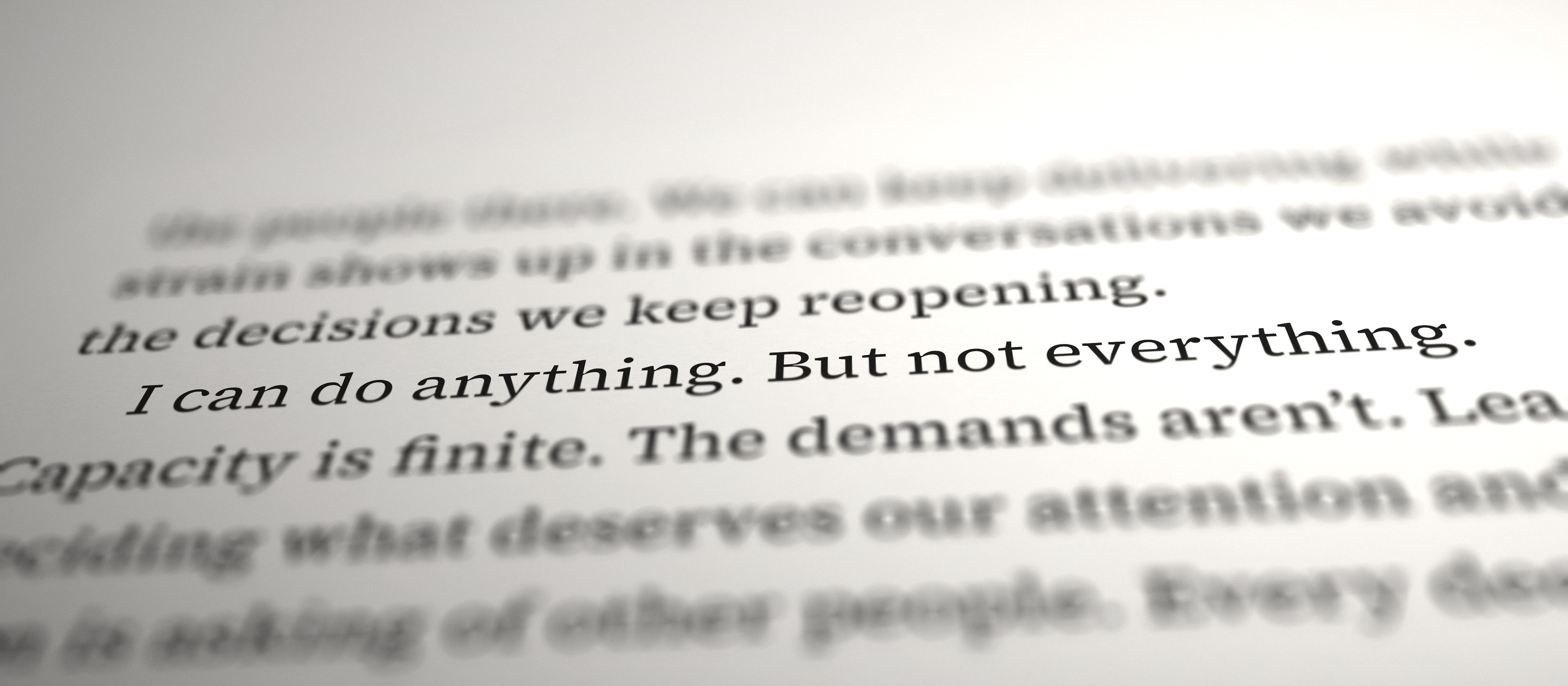 A printed page of Overloaded, in focus on the line: I can do anything. But not everything.